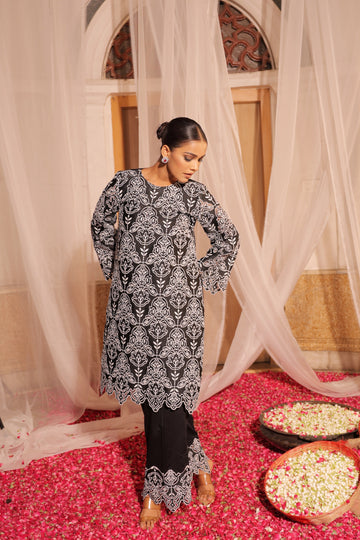 Elegant Black Hollow Embroidered Kurta with Straight Pants for a Chic Look